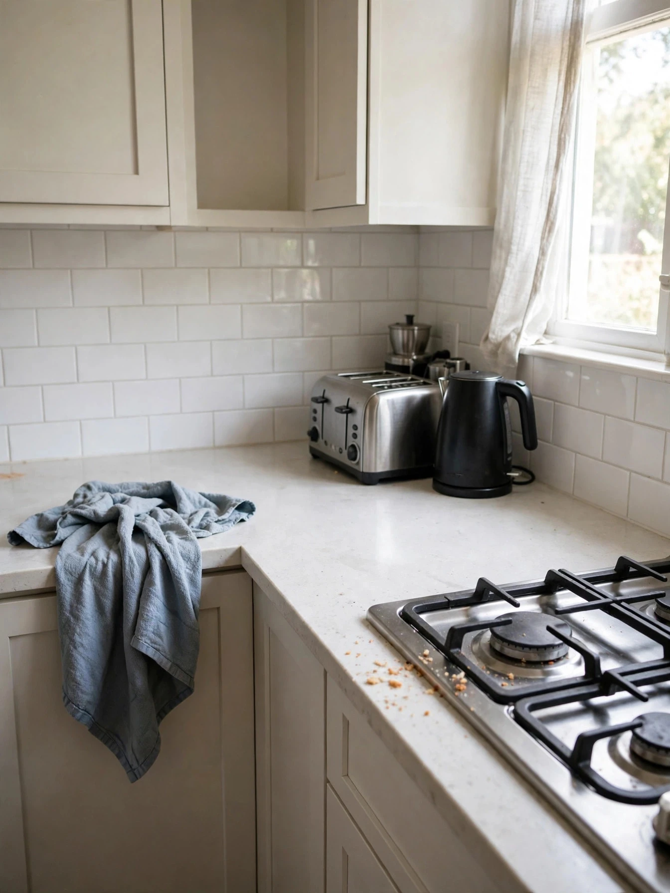 A decluttered kitchen with clear worktops and neatly organized cabinets