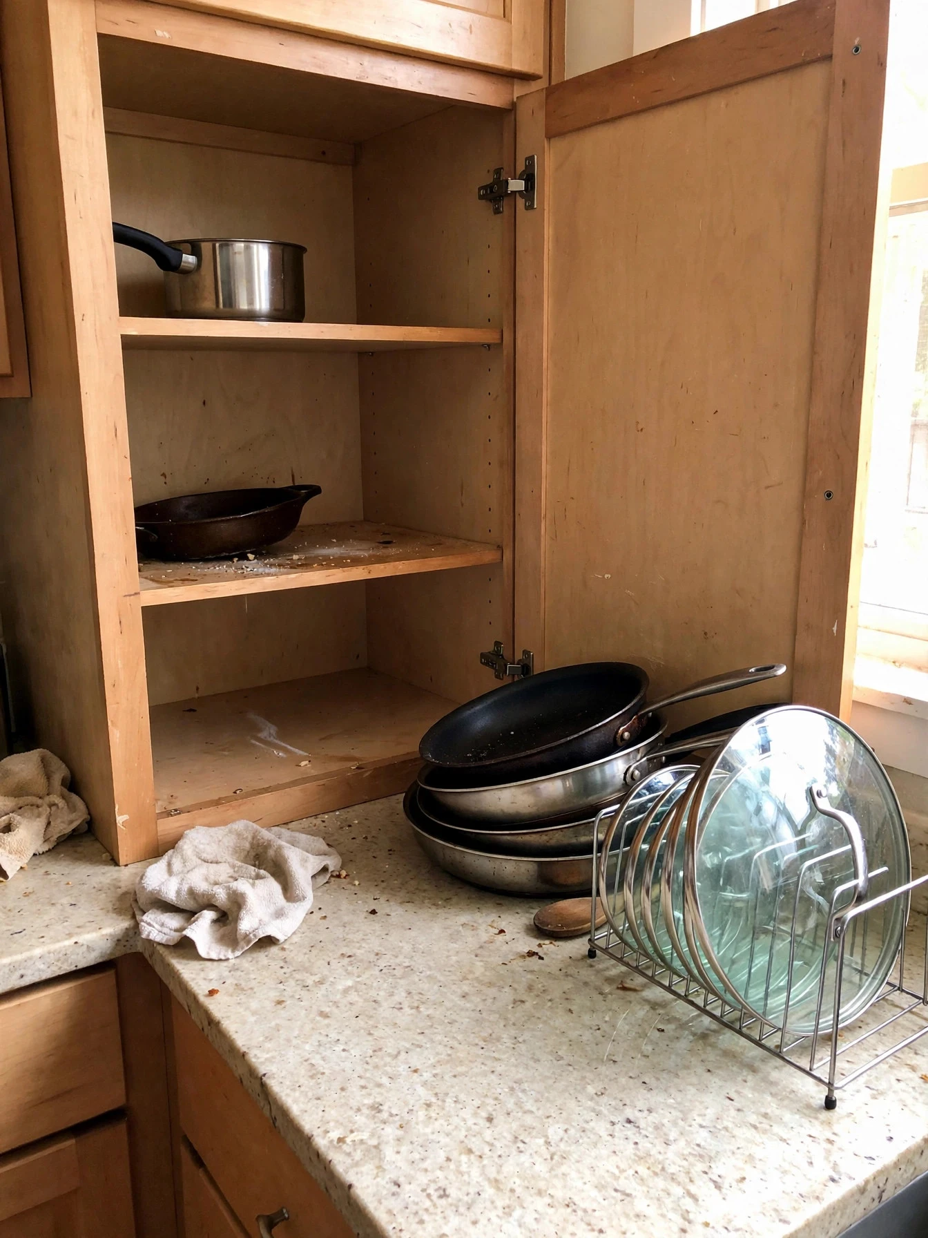 A decluttered kitchen with clear worktops and neatly organized cabinets