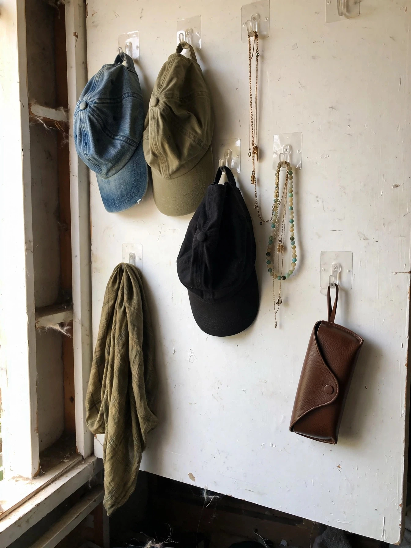 Over-the-door organizer on a closet door holding shoes and accessories in clear pockets